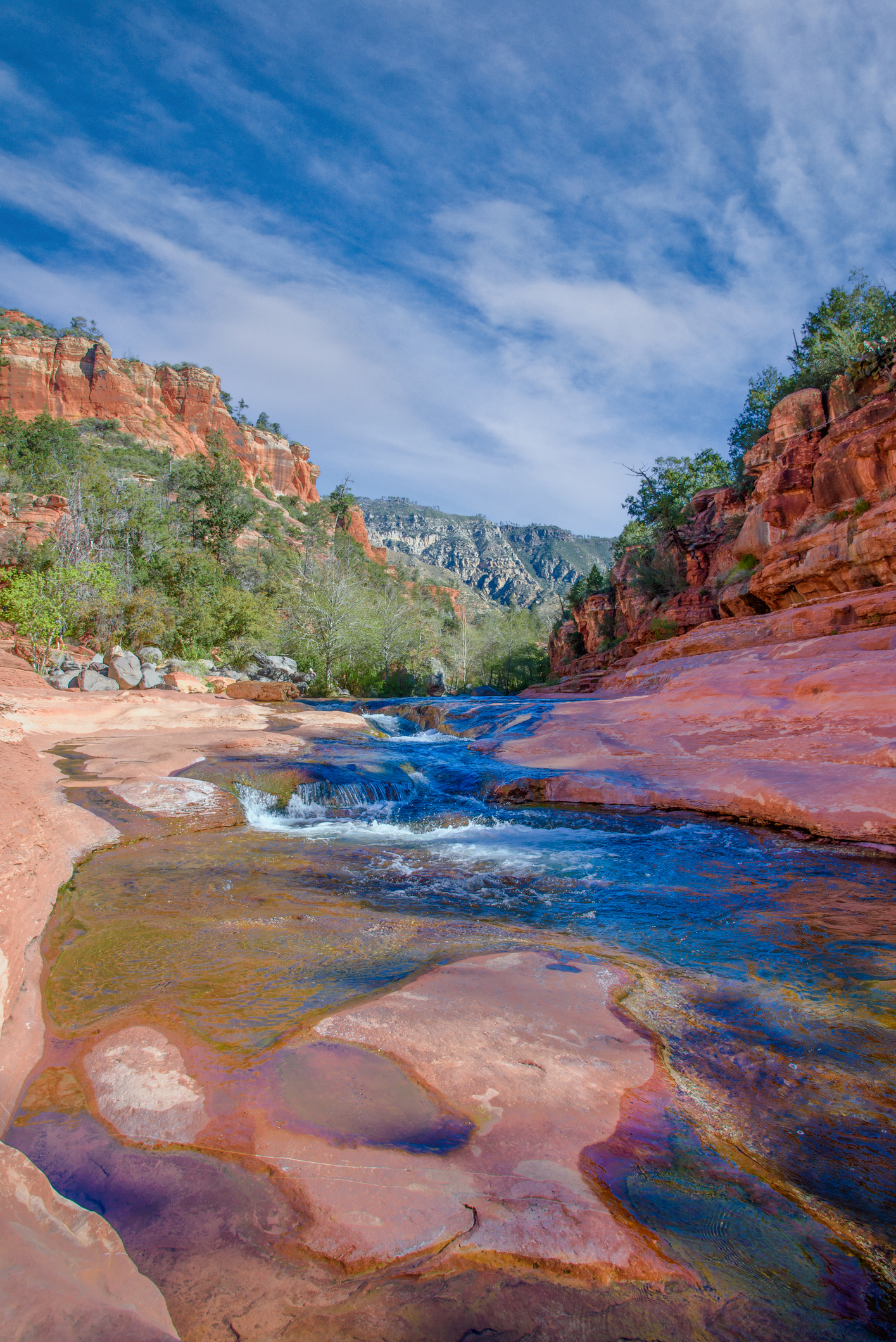 Oak Creek winds its way through the striking red rocks of Slide Rock State Park near Sedona, Arizona, USA