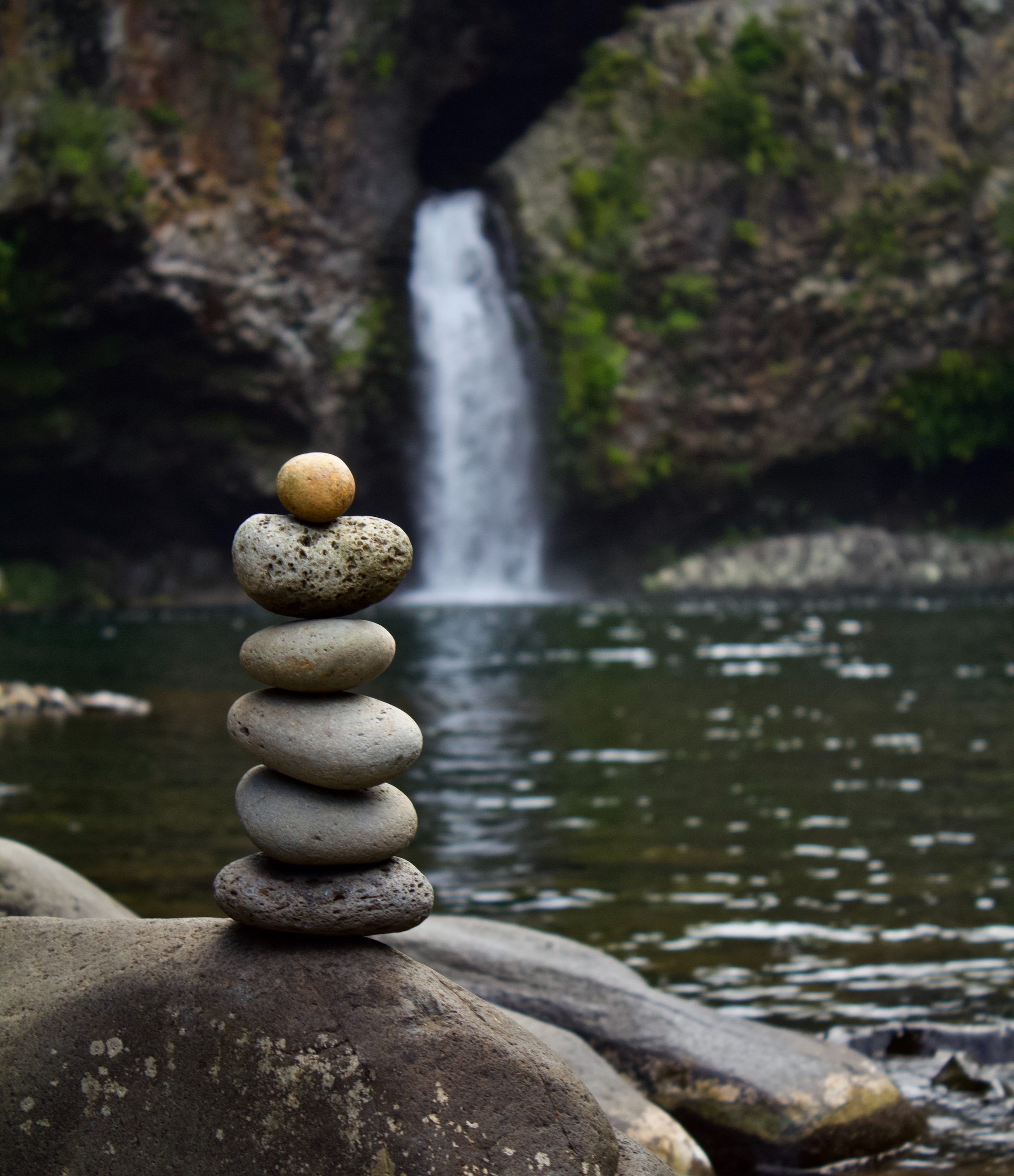 Rocks Stacked by Waterfall